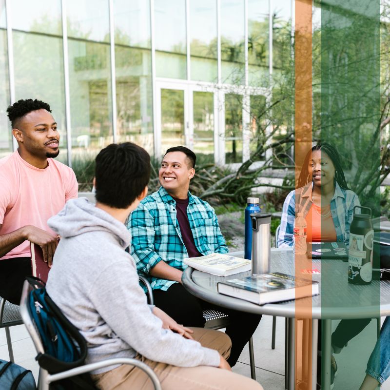 students at table on campus